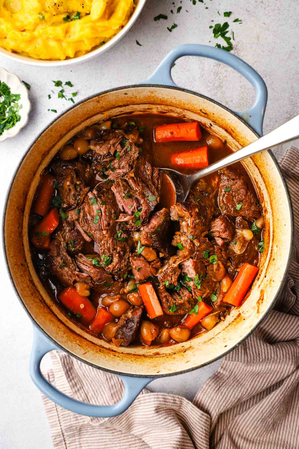 overhead view of a pot of braised beef