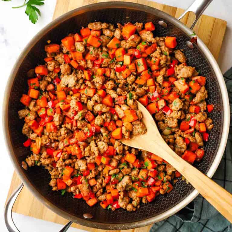 a pan with sweet potato and sausage hash.