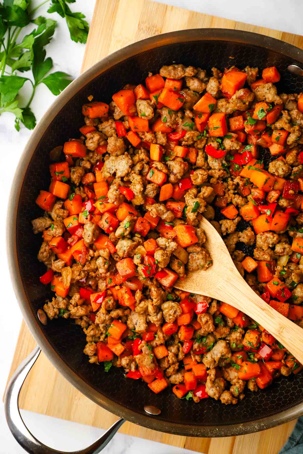 a skillet of sweet potato and sausage hash